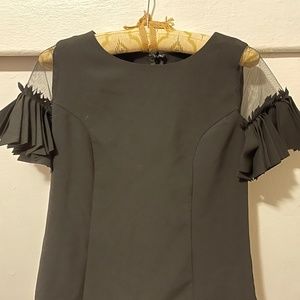 Elegant black blouse with sheer sleeves